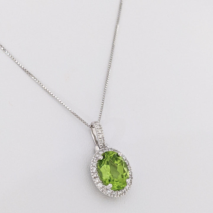 14K WHITE PERIDOT OVAL 7X9 WITH MELEE ESTATE HALO PENDANT & CHAIN 2.6 GRAMS