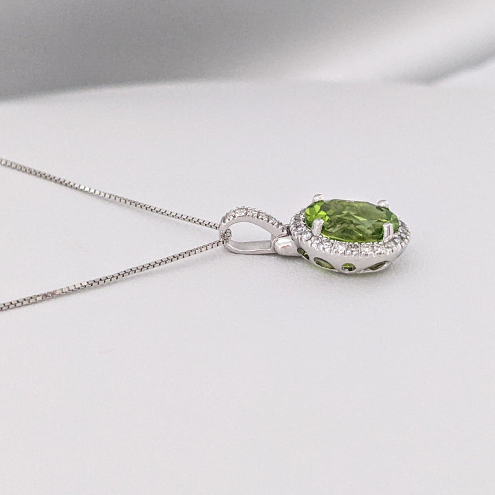 14K WHITE PERIDOT OVAL 7X9 WITH MELEE ESTATE HALO PENDANT & CHAIN 2.6 GRAMS