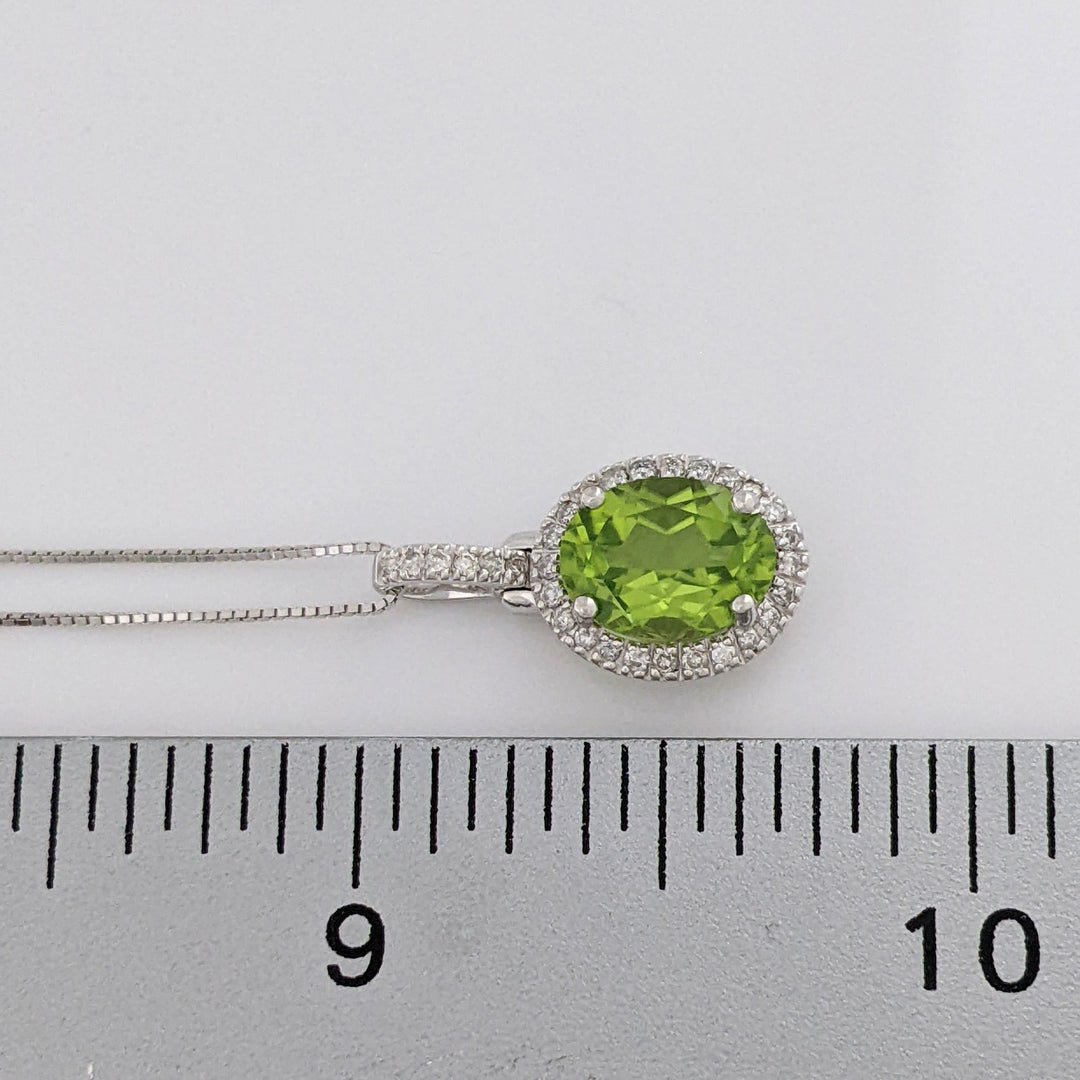 14K WHITE PERIDOT OVAL 7X9 WITH MELEE ESTATE HALO PENDANT & CHAIN 2.6 GRAMS