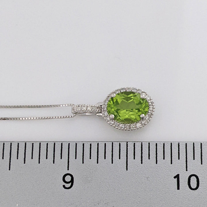 14K WHITE PERIDOT OVAL 7X9 WITH MELEE ESTATE HALO PENDANT & CHAIN 2.6 GRAMS