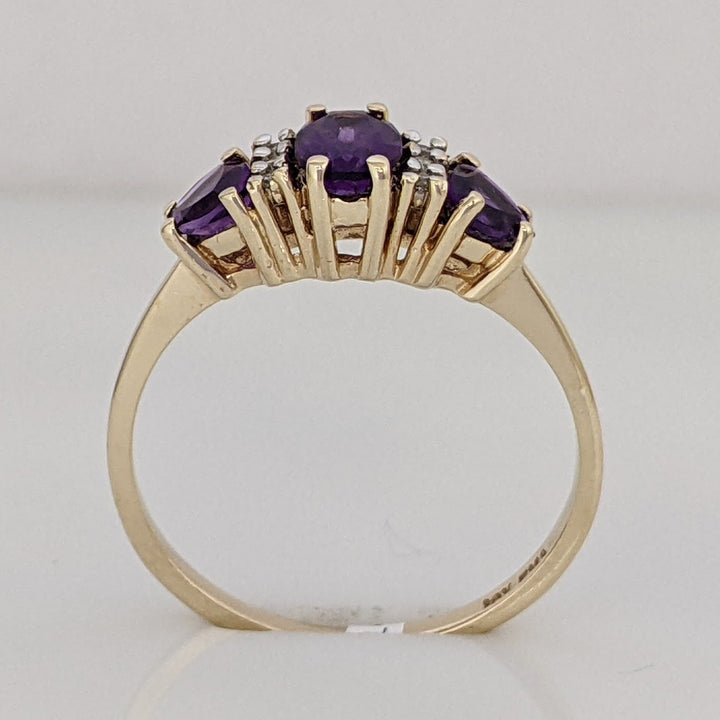 10K AMETHYST OVAL 4X6 WITH (2) TRILLION 4MM WITH (6) MELEE ESTATE RING 1.9 GRAMS