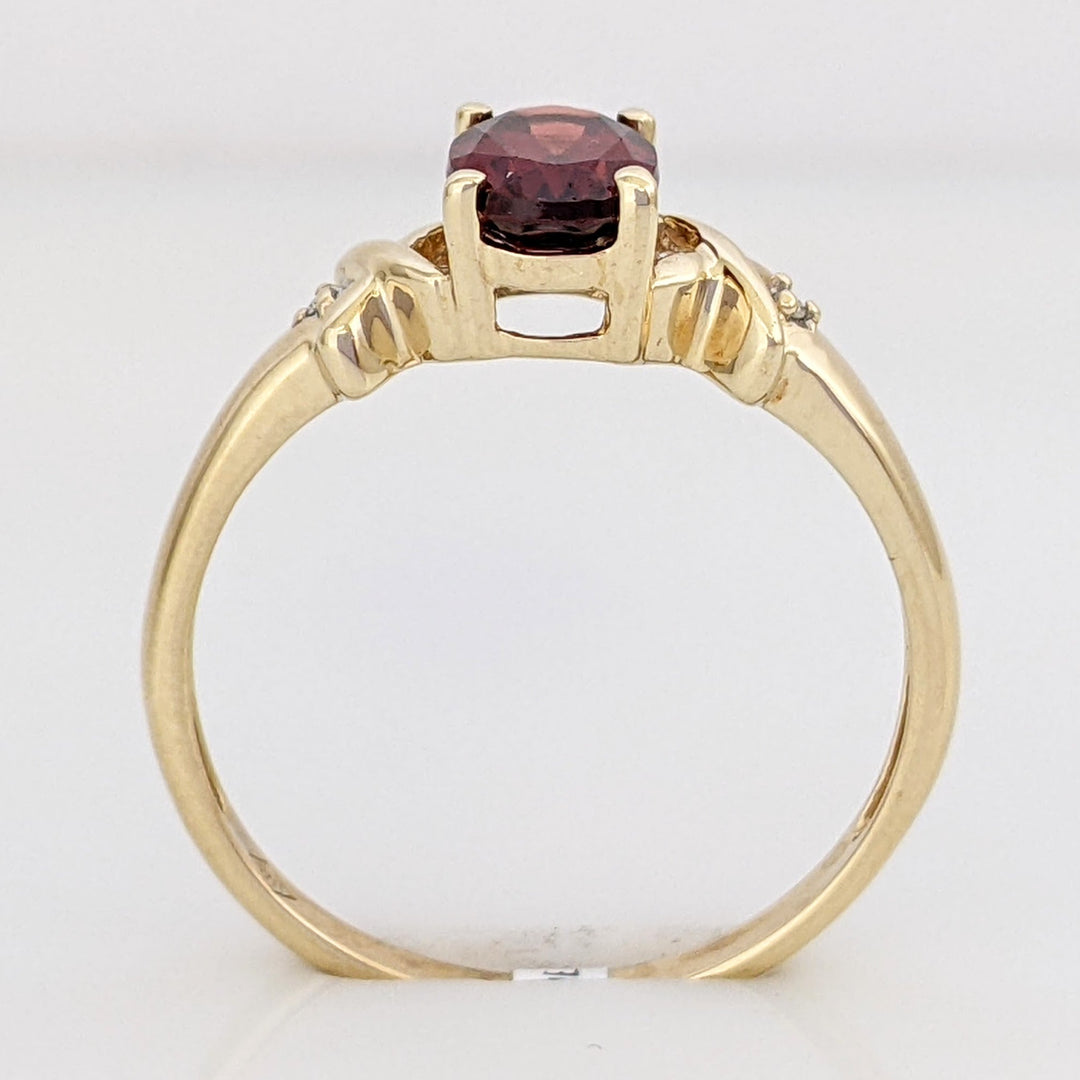 10K GARNET OVAL 5X7 WITH (2) MELEE ESTATE RING 1.8 GRAMS