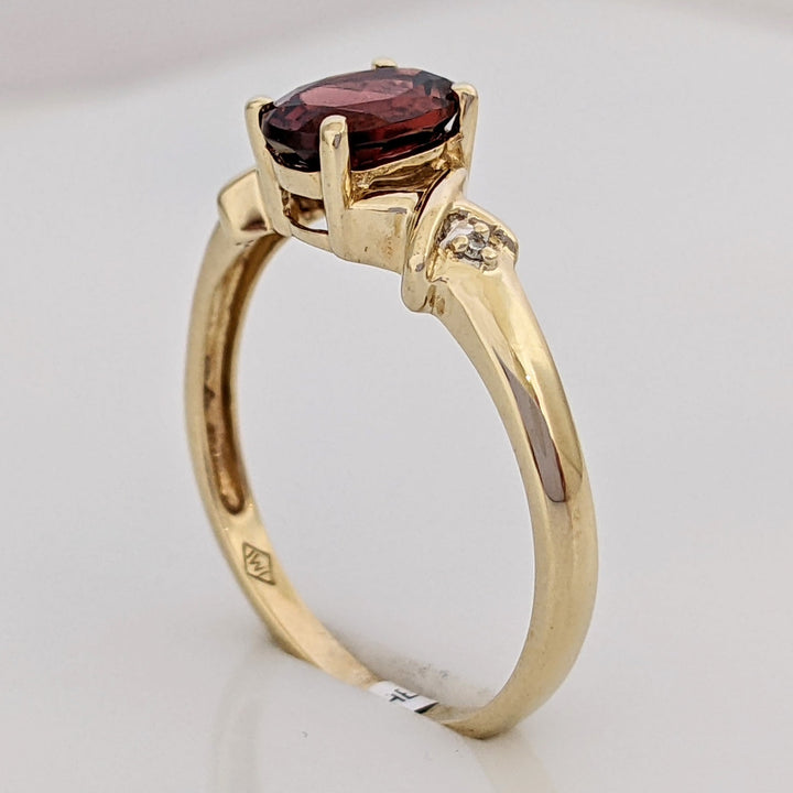 10K GARNET OVAL 5X7 WITH (2) MELEE ESTATE RING 1.8 GRAMS