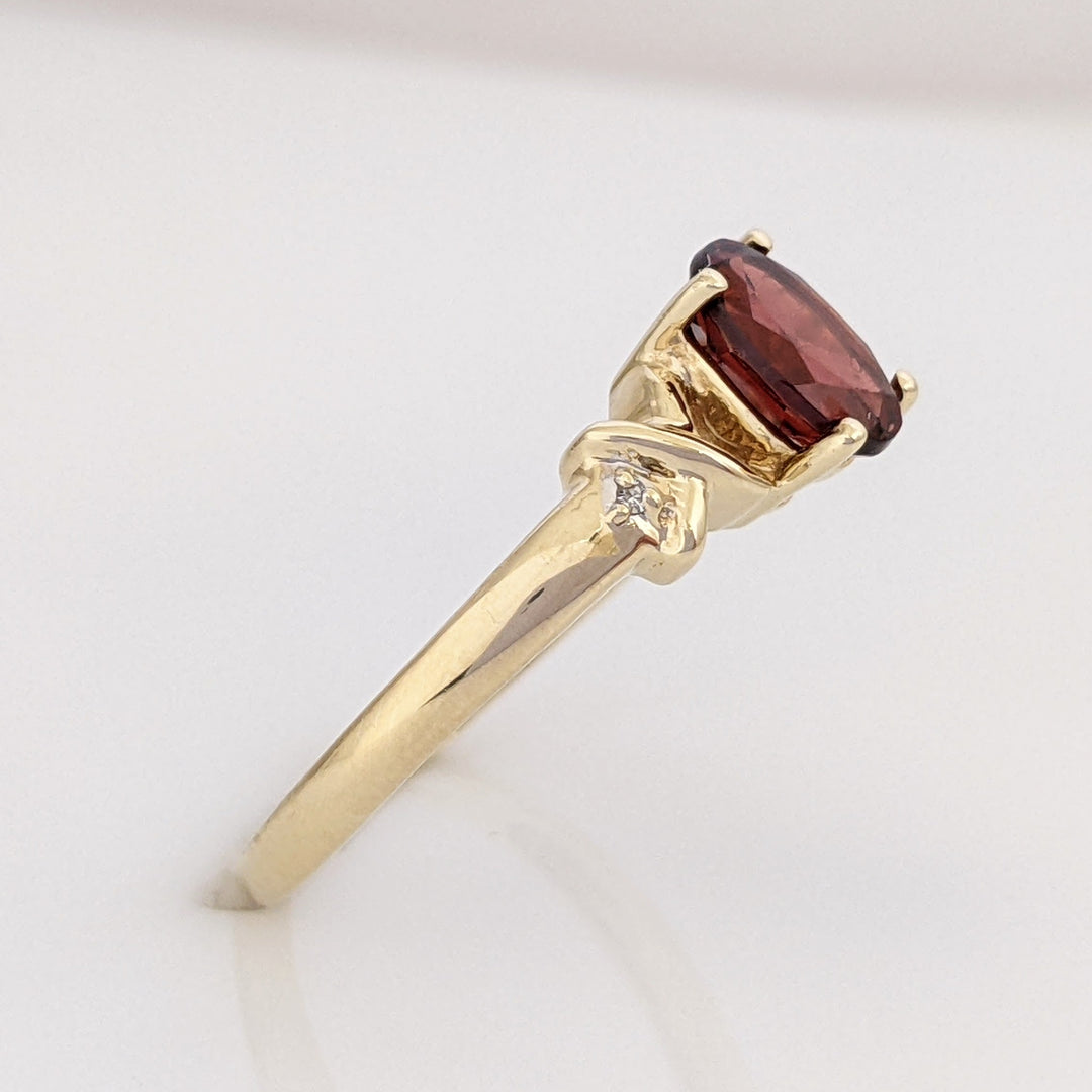 10K GARNET OVAL 5X7 WITH (2) MELEE ESTATE RING 1.8 GRAMS