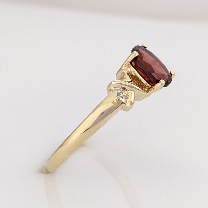 10K GARNET OVAL 5X7 WITH (2) MELEE ESTATE RING 1.8 GRAMS