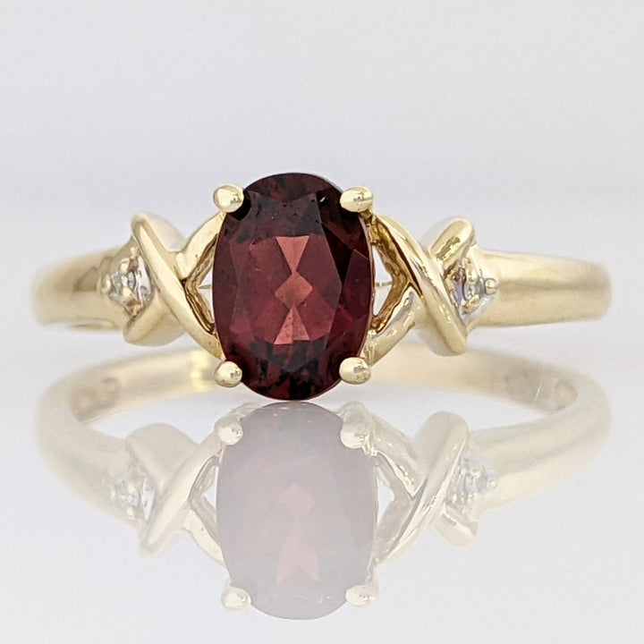 10K GARNET OVAL 5X7 WITH (2) MELEE ESTATE RING 1.8 GRAMS