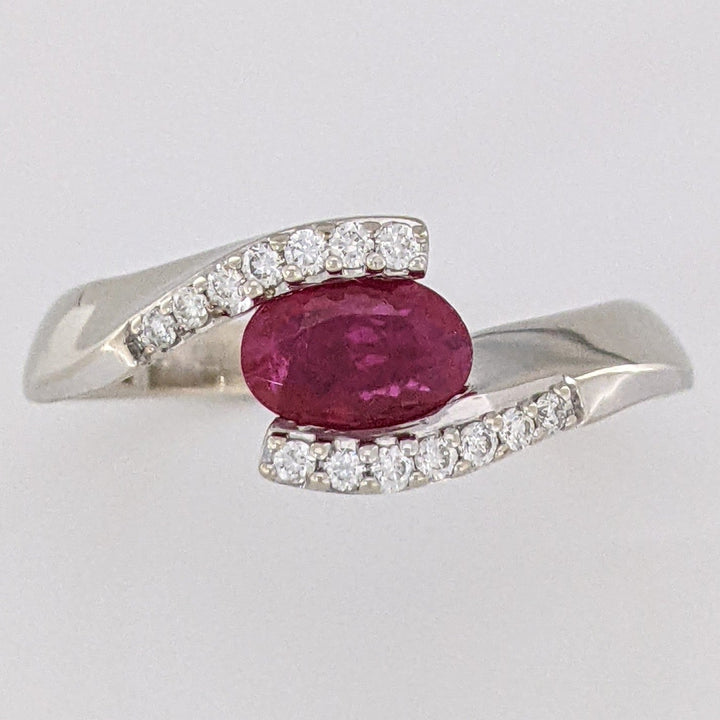 14K WHITE CLARITY ENHANCED RUBY OVAL 4X7 WITH .14 DIAMOND TOTAL WEIGHT ESTATE RING 4.7 GRAMS