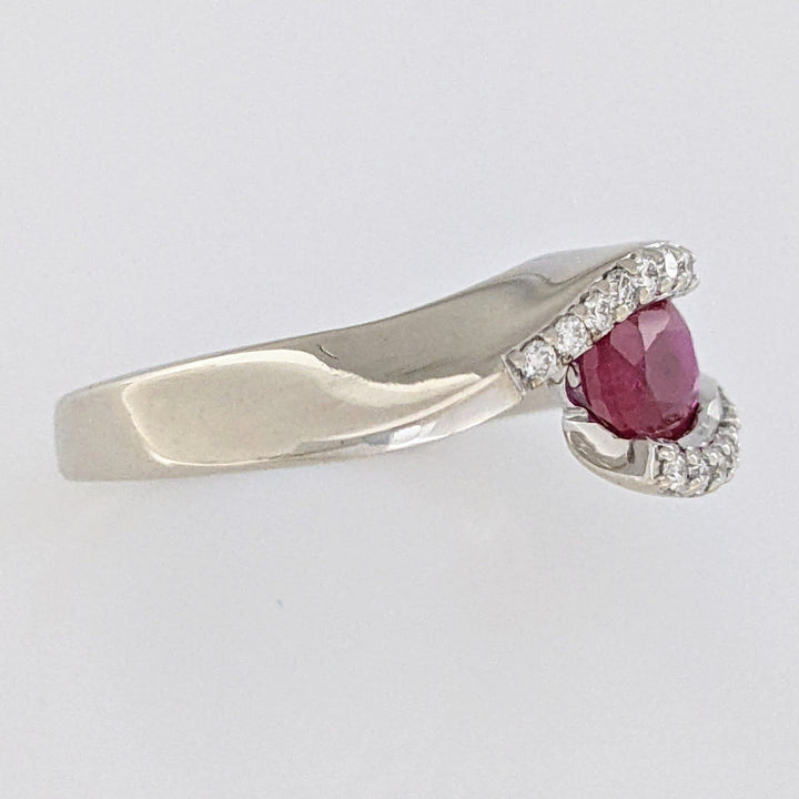 14K WHITE CLARITY ENHANCED RUBY OVAL 4X7 WITH .14 DIAMOND TOTAL WEIGHT ESTATE RING 4.7 GRAMS