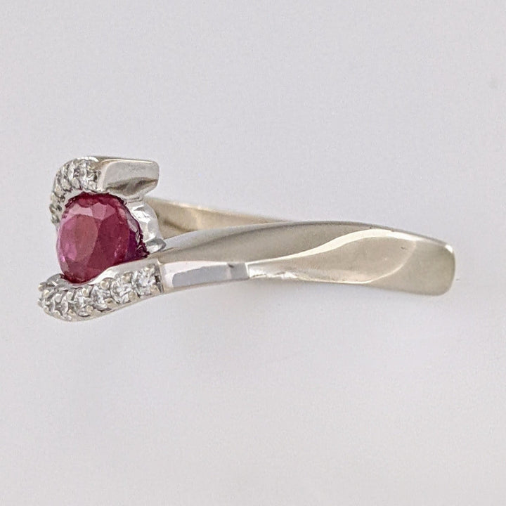 14K WHITE CLARITY ENHANCED RUBY OVAL 4X7 WITH .14 DIAMOND TOTAL WEIGHT ESTATE RING 4.7 GRAMS