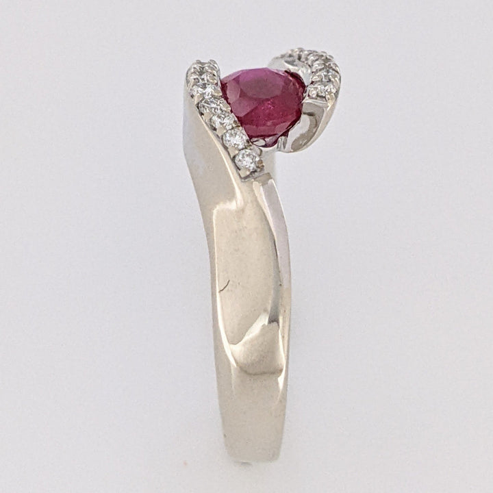 14K WHITE CLARITY ENHANCED RUBY OVAL 4X7 WITH .14 DIAMOND TOTAL WEIGHT ESTATE RING 4.7 GRAMS