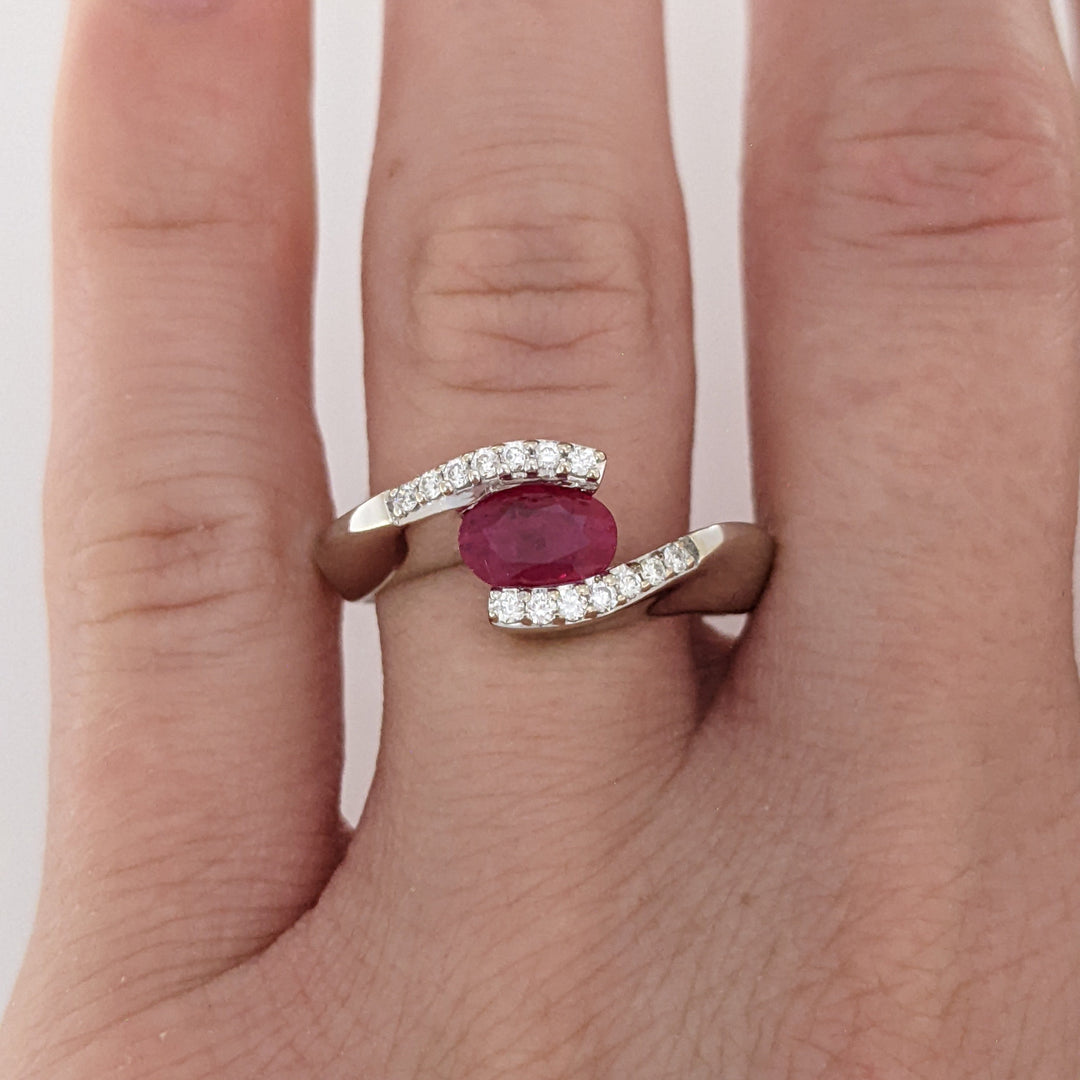 14K WHITE CLARITY ENHANCED RUBY OVAL 4X7 WITH .14 DIAMOND TOTAL WEIGHT ESTATE RING 4.7 GRAMS