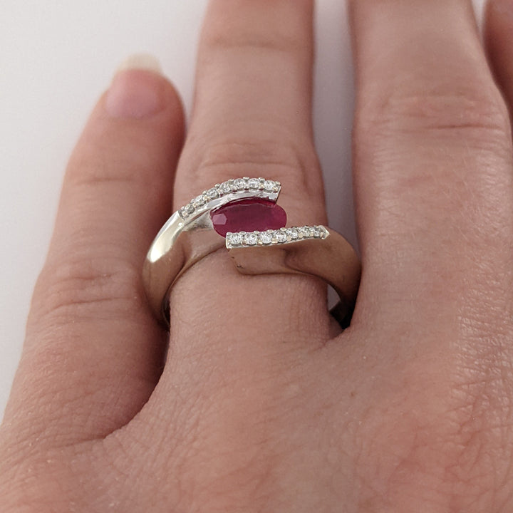 14K WHITE CLARITY ENHANCED RUBY OVAL 4X7 WITH .14 DIAMOND TOTAL WEIGHT ESTATE RING 4.7 GRAMS