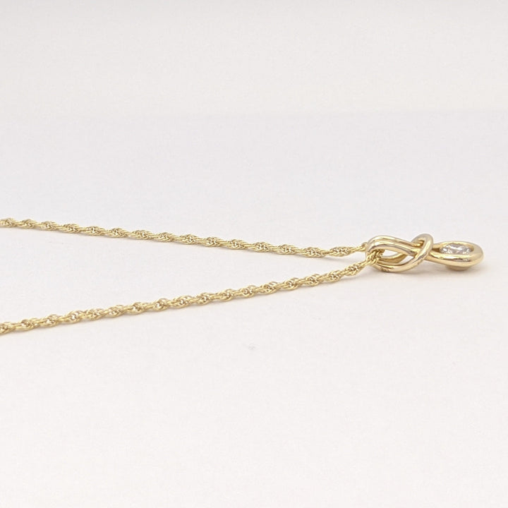 14K .16 CARAT TOTAL VS1 I DIAMOND ROUND LOVE KNOT ESTATE PENDANT & CHAIN 2.1 GRAMS