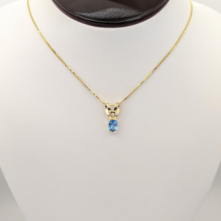 14K BLUE TOPAZ OVAL 6X8 HALF-BEZEL WITH MELEE ESTATE PENDANT & CHAIN 5.1 GRAMS