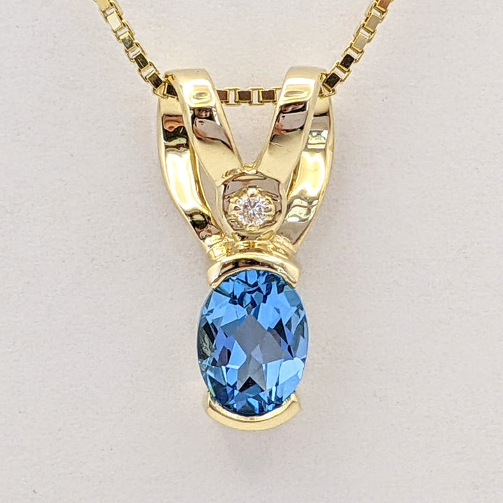 14K BLUE TOPAZ OVAL 6X8 HALF-BEZEL WITH MELEE ESTATE PENDANT & CHAIN 5.1 GRAMS