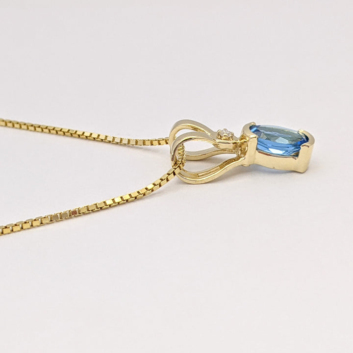 14K BLUE TOPAZ OVAL 6X8 HALF-BEZEL WITH MELEE ESTATE PENDANT & CHAIN 5.1 GRAMS