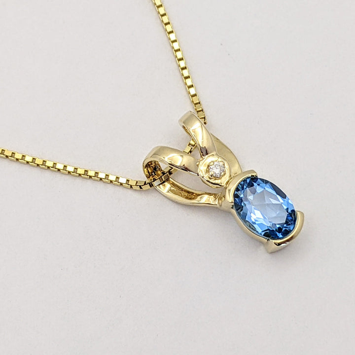 14K BLUE TOPAZ OVAL 6X8 HALF-BEZEL WITH MELEE ESTATE PENDANT & CHAIN 5.1 GRAMS