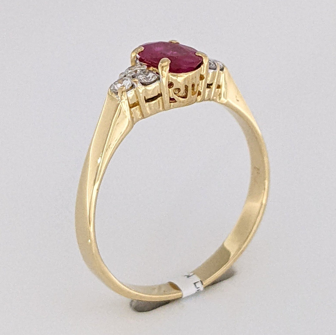 18K RUBY OVAL 4.9X6.6 OVAL WITH .18 DIAMOND TOTAL WEIGHT (6) ROUND ESTATE RING 3.4 GRAMS