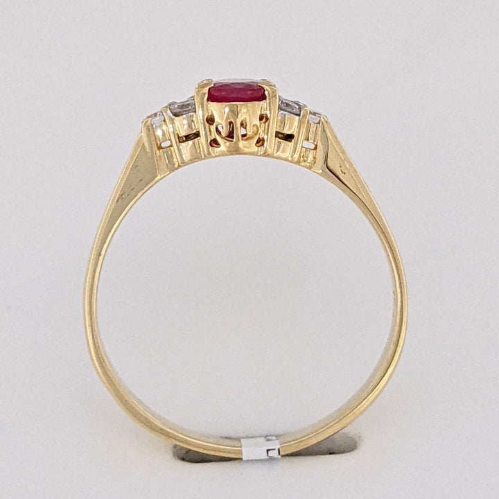 18K RUBY OVAL 4.9X6.6 OVAL WITH .18 DIAMOND TOTAL WEIGHT (6) ROUND ESTATE RING 3.4 GRAMS