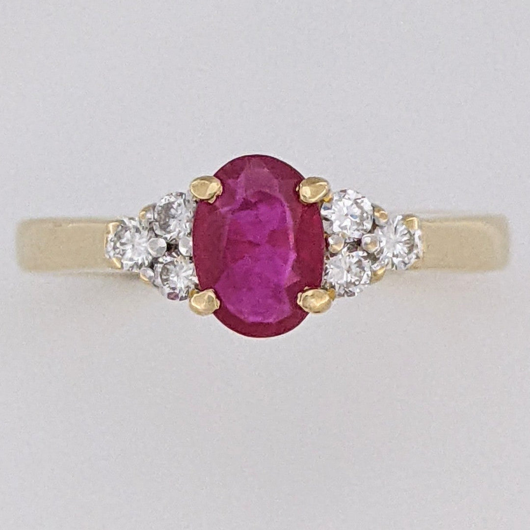 18K RUBY OVAL 4.9X6.6 OVAL WITH .18 DIAMOND TOTAL WEIGHT (6) ROUND ESTATE RING 3.4 GRAMS