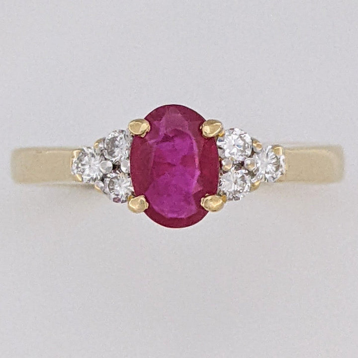 18K RUBY OVAL 4.9X6.6 OVAL WITH .18 DIAMOND TOTAL WEIGHT (6) ROUND ESTATE RING 3.4 GRAMS