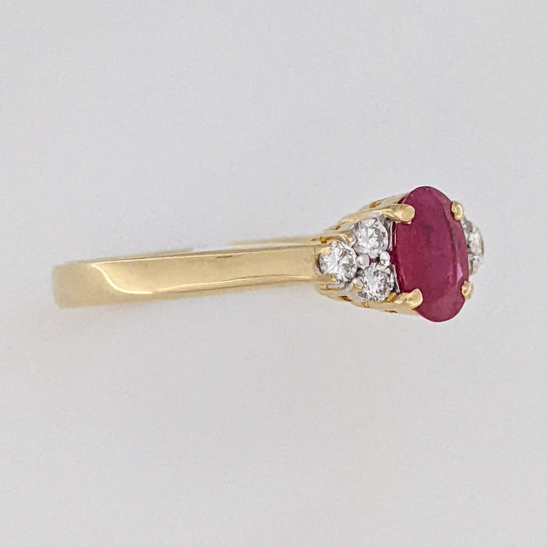 18K RUBY OVAL 4.9X6.6 OVAL WITH .18 DIAMOND TOTAL WEIGHT (6) ROUND ESTATE RING 3.4 GRAMS