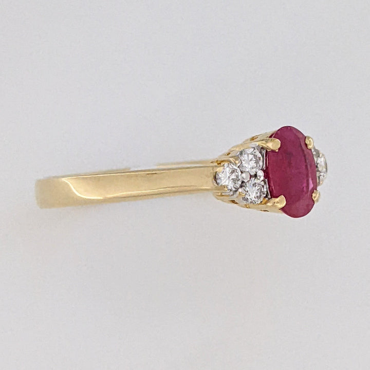 18K RUBY OVAL 4.9X6.6 OVAL WITH .18 DIAMOND TOTAL WEIGHT (6) ROUND ESTATE RING 3.4 GRAMS