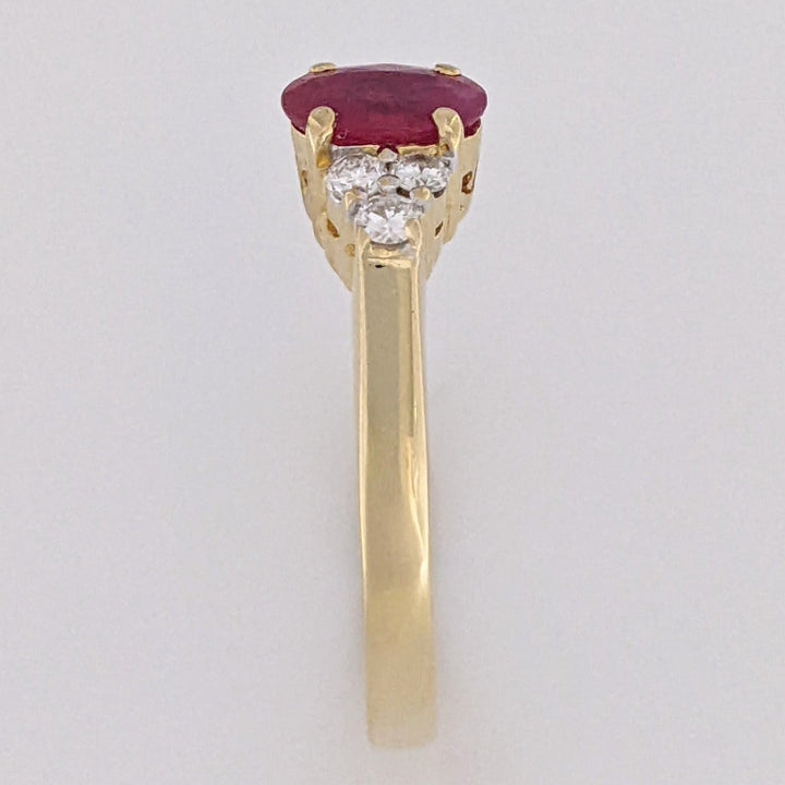 18K RUBY OVAL 4.9X6.6 OVAL WITH .18 DIAMOND TOTAL WEIGHT (6) ROUND ESTATE RING 3.4 GRAMS