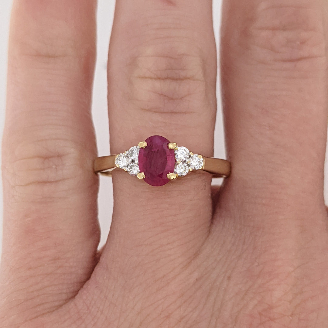 18K RUBY OVAL 4.9X6.6 OVAL WITH .18 DIAMOND TOTAL WEIGHT (6) ROUND ESTATE RING 3.4 GRAMS
