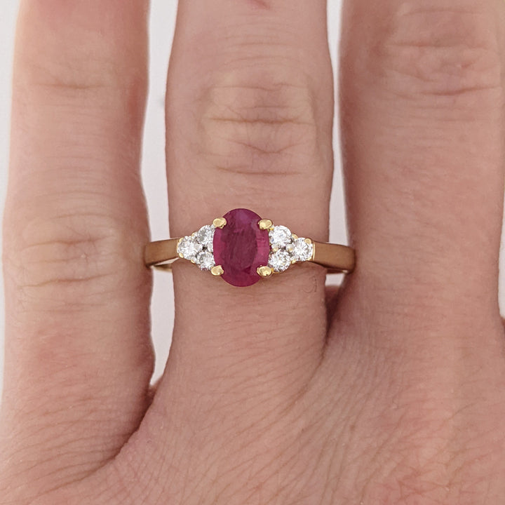 18K RUBY OVAL 4.9X6.6 OVAL WITH .18 DIAMOND TOTAL WEIGHT (6) ROUND ESTATE RING 3.4 GRAMS