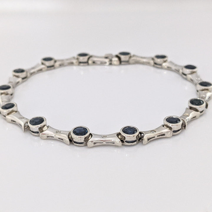 14K WHITE SAPPHIRE ROUND (14) 4MM BEZEL WITH .13 DIAMOND TOTAL WEIGHT ESTATE BRACELET 12.7 GRAMS