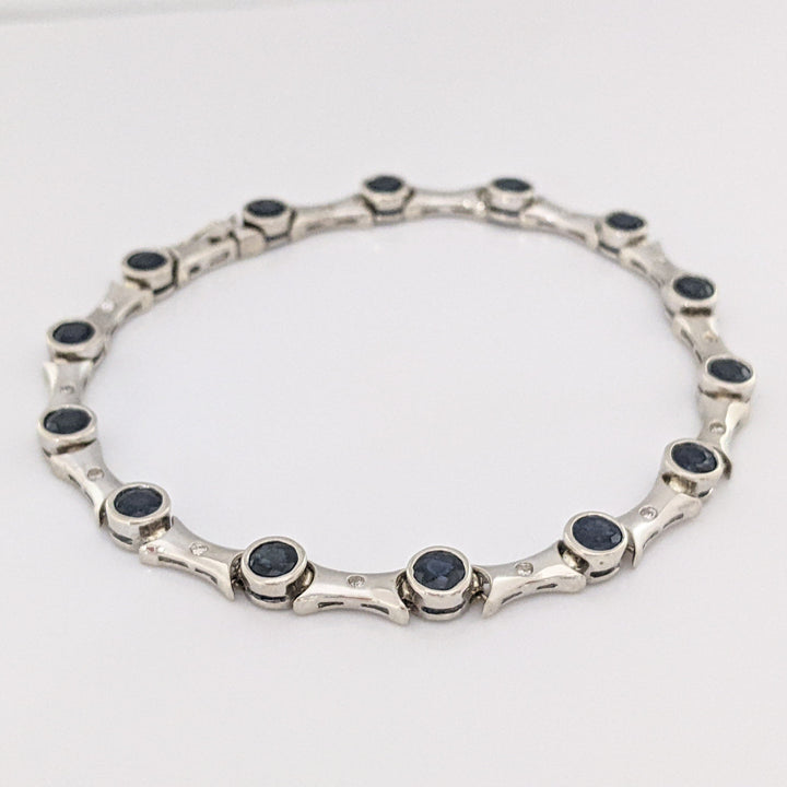 14K WHITE SAPPHIRE ROUND (14) 4MM BEZEL WITH .13 DIAMOND TOTAL WEIGHT ESTATE BRACELET 12.7 GRAMS
