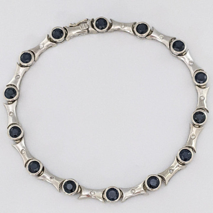 14K WHITE SAPPHIRE ROUND (14) 4MM BEZEL WITH .13 DIAMOND TOTAL WEIGHT ESTATE BRACELET 12.7 GRAMS