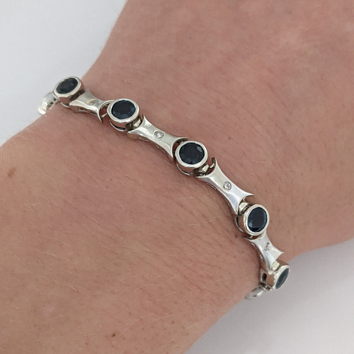 14K WHITE SAPPHIRE ROUND (14) 4MM BEZEL WITH .13 DIAMOND TOTAL WEIGHT ESTATE BRACELET 12.7 GRAMS