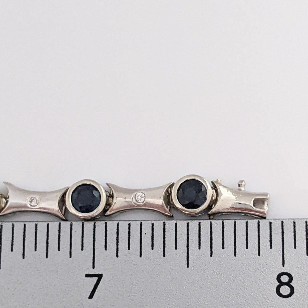 14K WHITE SAPPHIRE ROUND (14) 4MM BEZEL WITH .13 DIAMOND TOTAL WEIGHT ESTATE BRACELET 12.7 GRAMS