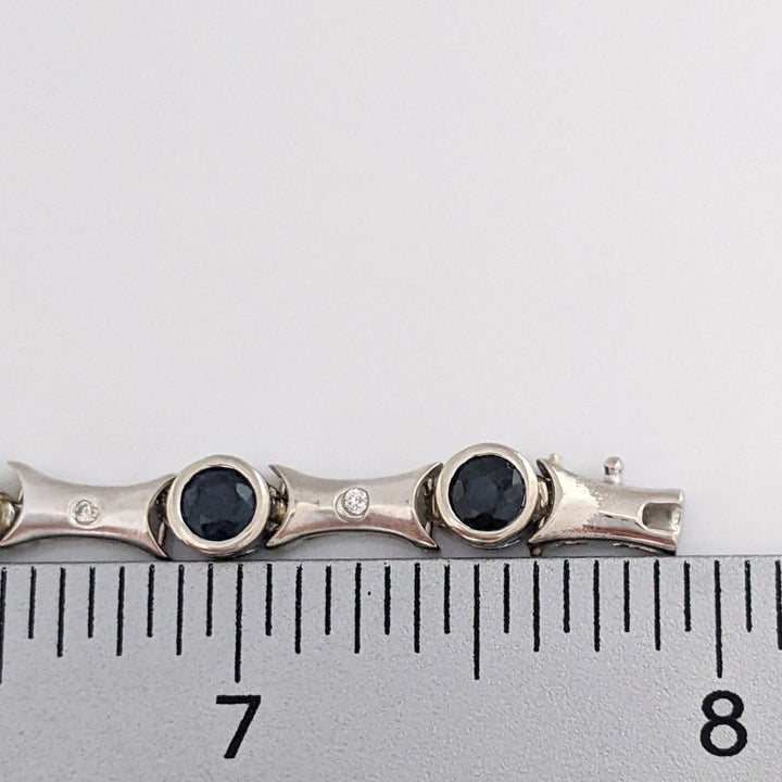 14K WHITE SAPPHIRE ROUND (14) 4MM BEZEL WITH .13 DIAMOND TOTAL WEIGHT ESTATE BRACELET 12.7 GRAMS