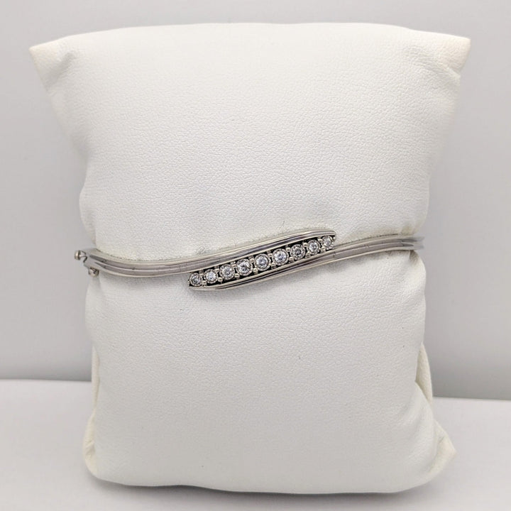 STERLING SILVER .27 CARAT TOTAL WEIGHT DIAMOND ROUND (9) ESTATE BYPASS BANGLE 12.2 GRAMS