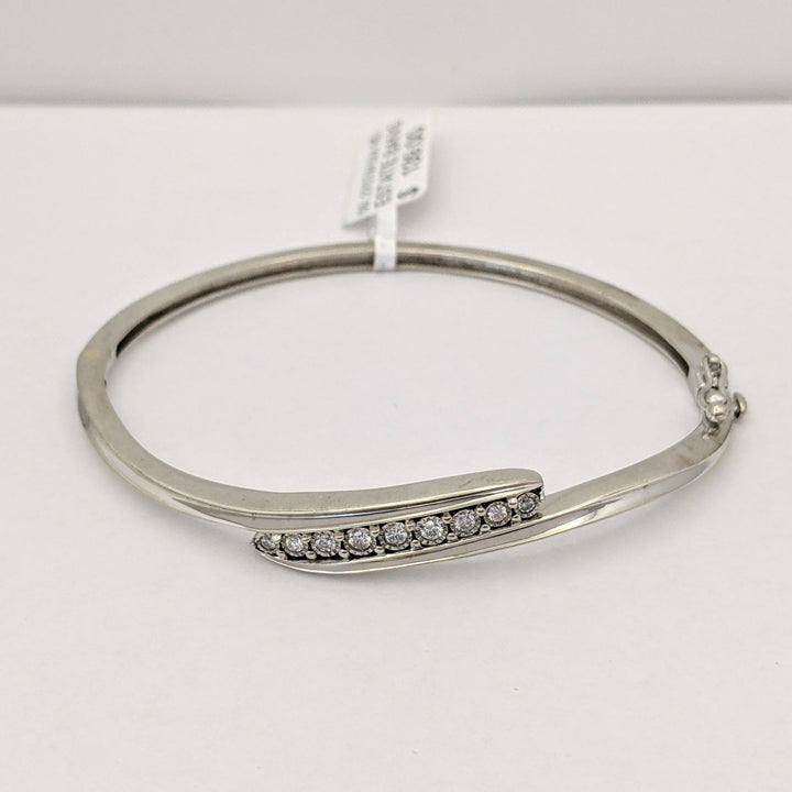 STERLING SILVER .27 CARAT TOTAL WEIGHT DIAMOND ROUND (9) ESTATE BYPASS BANGLE 12.2 GRAMS