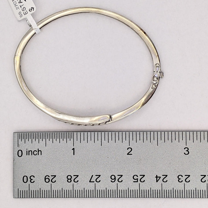 STERLING SILVER .27 CARAT TOTAL WEIGHT DIAMOND ROUND (9) ESTATE BYPASS BANGLE 12.2 GRAMS