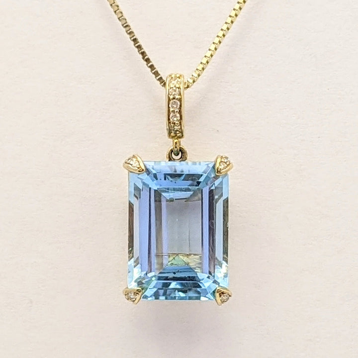 10K BLUE TOPAZ EMERALD CUT 10X14 WITH (5) MELEE ESTATE PENDANT & 14K CHAIN 5.3 GRAMS