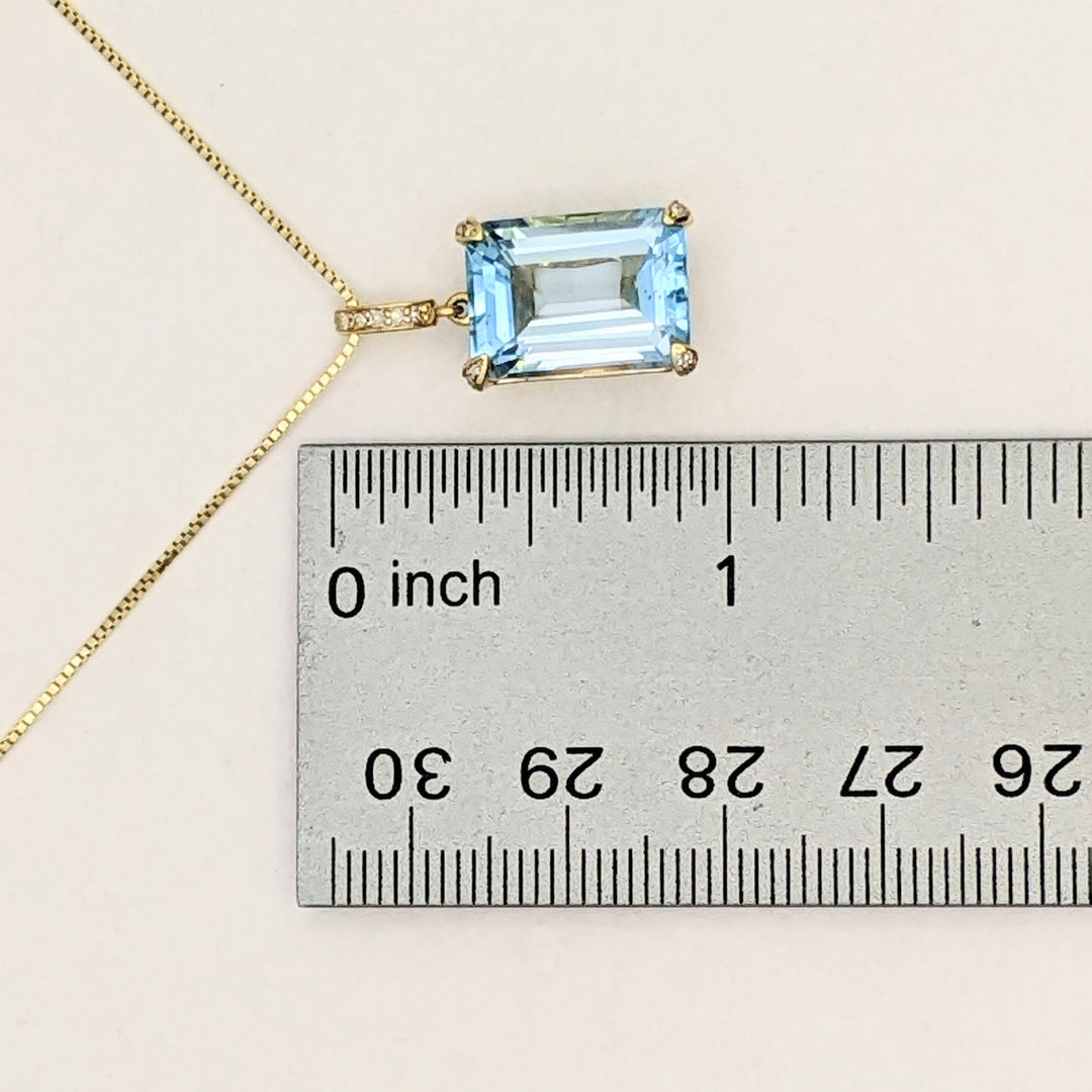 10K BLUE TOPAZ EMERALD CUT 10X14 WITH (5) MELEE ESTATE PENDANT & 14K CHAIN 5.3 GRAMS