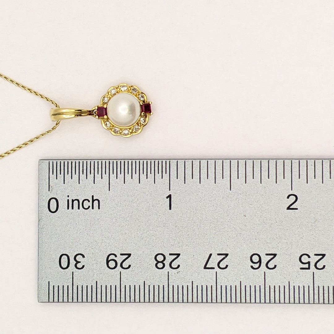 18K PEARL ROUND 7MM WITH .10 DIAMOND TOTAL WEIGHT (10) ROUND AND RUBY (2) PRINCESS CUT ESTATE PENDANT & 14K CHAIN 5.0 GRAMS
