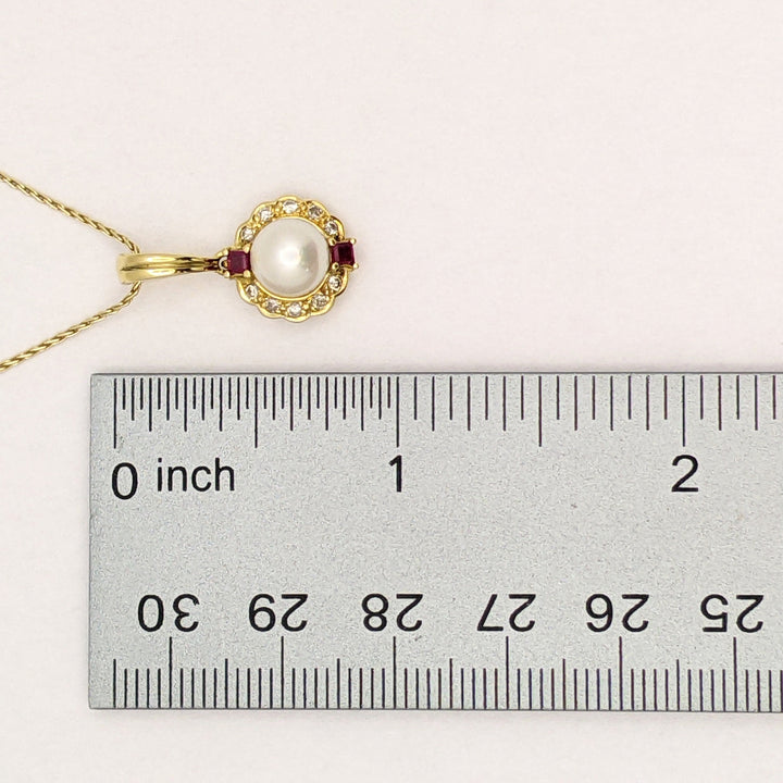 18K PEARL ROUND 7MM WITH .10 DIAMOND TOTAL WEIGHT (10) ROUND AND RUBY (2) PRINCESS CUT ESTATE PENDANT & 14K CHAIN 5.0 GRAMS
