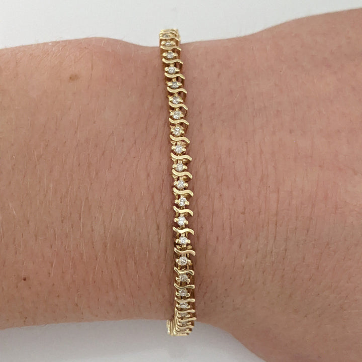 14K .80 CARAT TOTAL WEIGHT I1 I DIAMOND ROUND (64) S- LINK ESTATE BRACELET 7.6 GRAMS