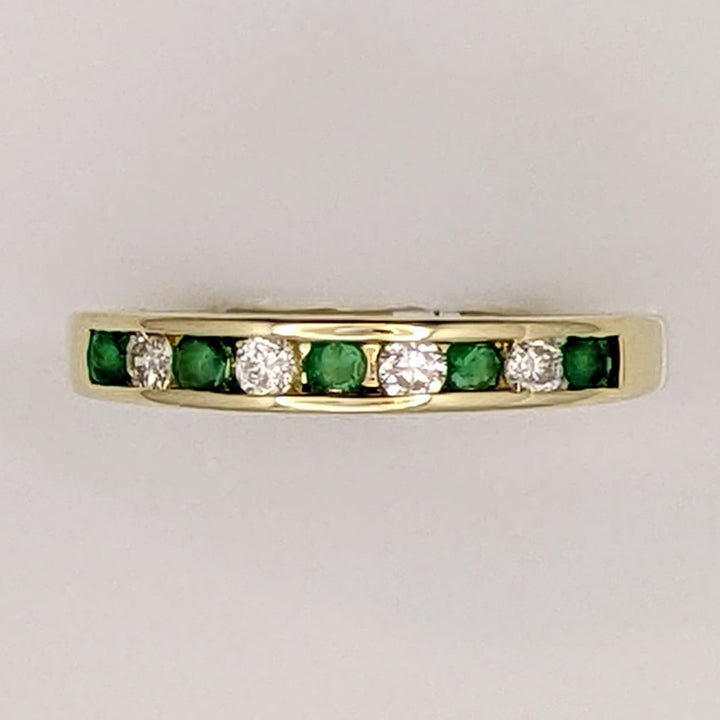 14K EMERALD ROUND (5) 2MM WITH .12 DIAMOND TOTAL WEIGHT (4) ROUND ESTATE CHANNEL BAND 2.0 GRAMS
