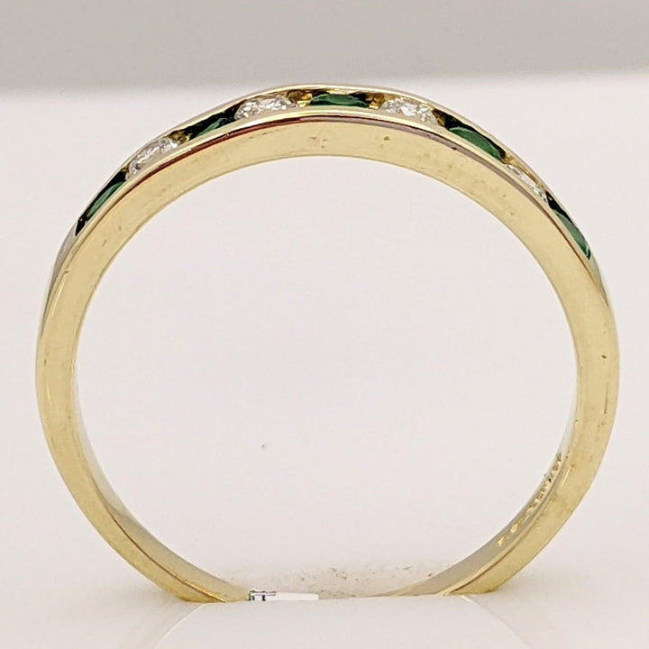 14K EMERALD ROUND (5) 2MM WITH .12 DIAMOND TOTAL WEIGHT (4) ROUND ESTATE CHANNEL BAND 2.0 GRAMS