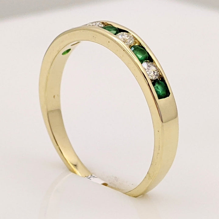 14K EMERALD ROUND (5) 2MM WITH .12 DIAMOND TOTAL WEIGHT (4) ROUND ESTATE CHANNEL BAND 2.0 GRAMS