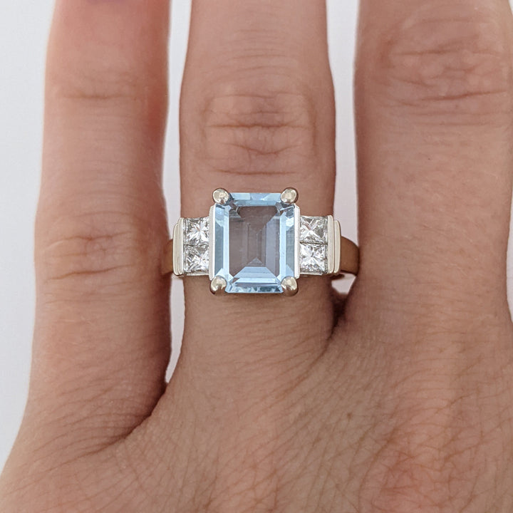 14K TWO-TONE AQUAMARINE EMERALD CUT 7X9 WITH .72 DIAMOND TOTAL WEIGHT (4) PRINCESS CUT ESTATE RING 6.2 GRAMS