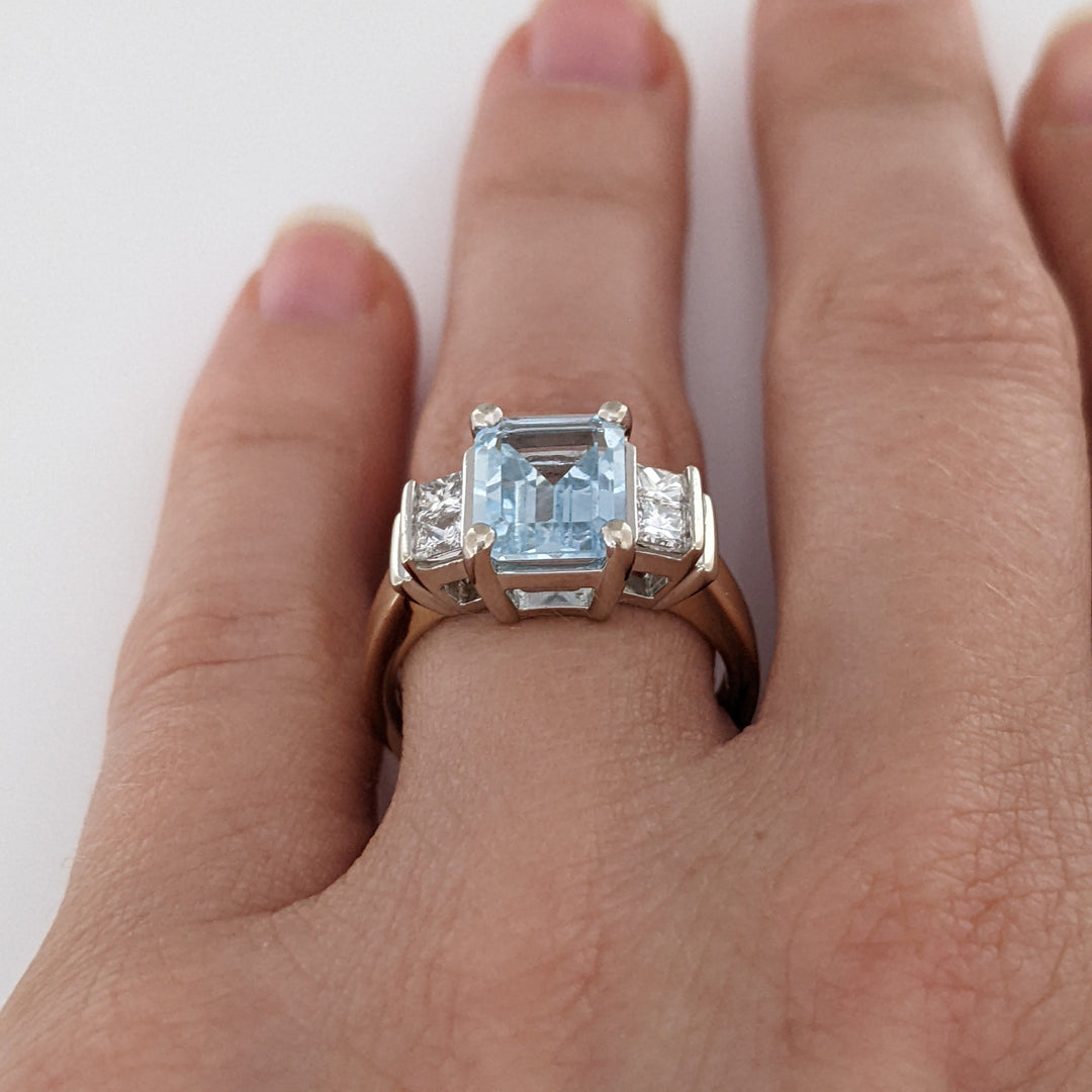 14K TWO-TONE AQUAMARINE EMERALD CUT 7X9 WITH .72 DIAMOND TOTAL WEIGHT (4) PRINCESS CUT ESTATE RING 6.2 GRAMS