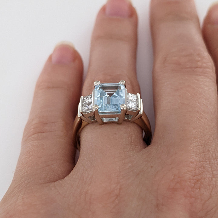 14K TWO-TONE AQUAMARINE EMERALD CUT 7X9 WITH .72 DIAMOND TOTAL WEIGHT (4) PRINCESS CUT ESTATE RING 6.2 GRAMS